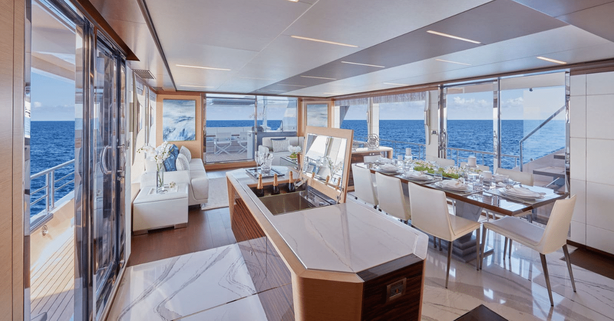 Bright yacht dining area with polished marble floors and ocean view, maintained by Pacific Marble Restoration.