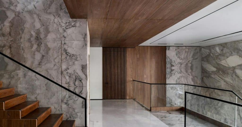 Modern interior space with polished marble floors and marble wall cladding