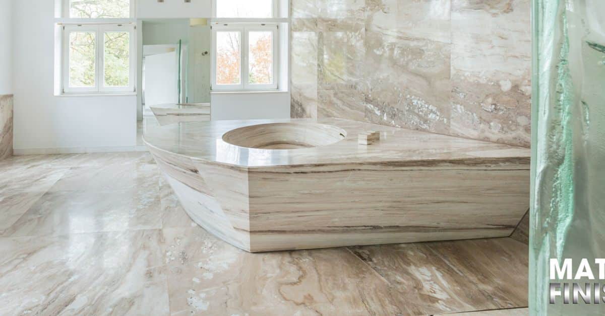 Polished marble bathroom floor and walls with restored shine and natural stone patterns