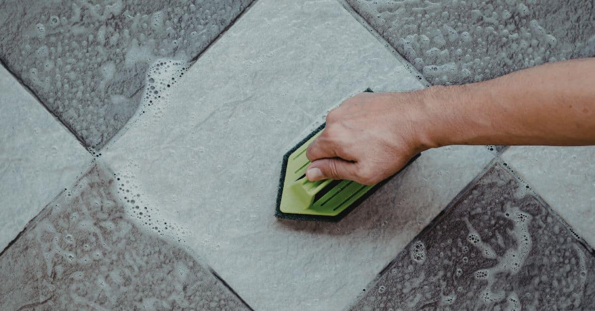 Hand scrubbing porcelain tile floor using safe cleaning method
